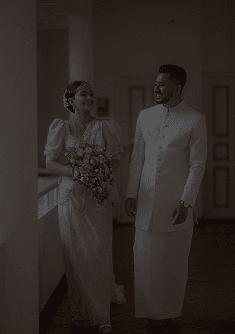 Close portrait of a couple with the bride in a lace gown